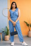Front and back view of a Saivalya Fashion ice blue ruffled denim jumpsuit with an elasticated waist