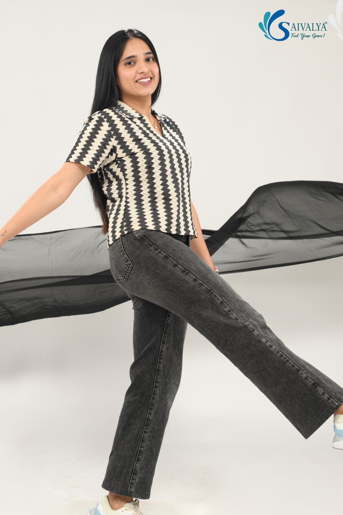 Front and back view of the Saivalya Tarang Zigzag Polo featuring a bold black and Off White textured geometric pattern, an open notch collar, and a modern boxy silhouette in organic fabric